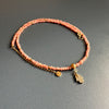 14-karat gold rhodochrosite hamsa hand necklace