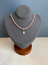 14-karat gold rhodochrosite hamsa hand necklace