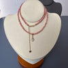 14-karat gold rhodochrosite hamsa hand necklace
